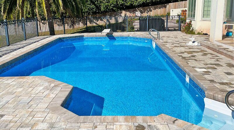 a vinyl lined pool with diving board
