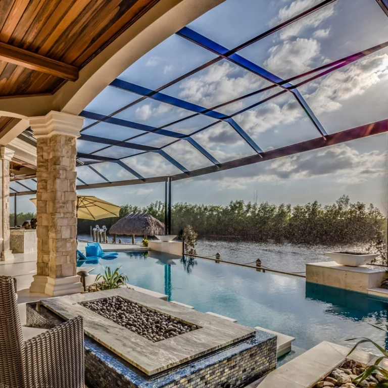 Inground pool beneath a screened enclosure